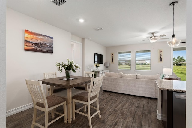 dining room featuring ceiling fan and dark hardwood / wood-style floors