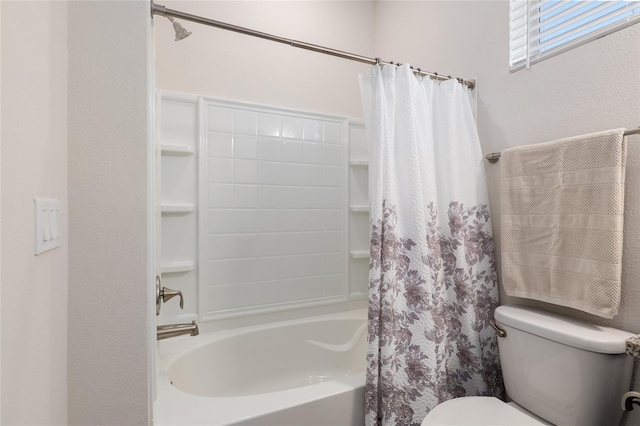 bathroom with shower / bath combo and toilet