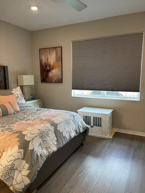 bedroom featuring hardwood / wood-style floors and ceiling fan