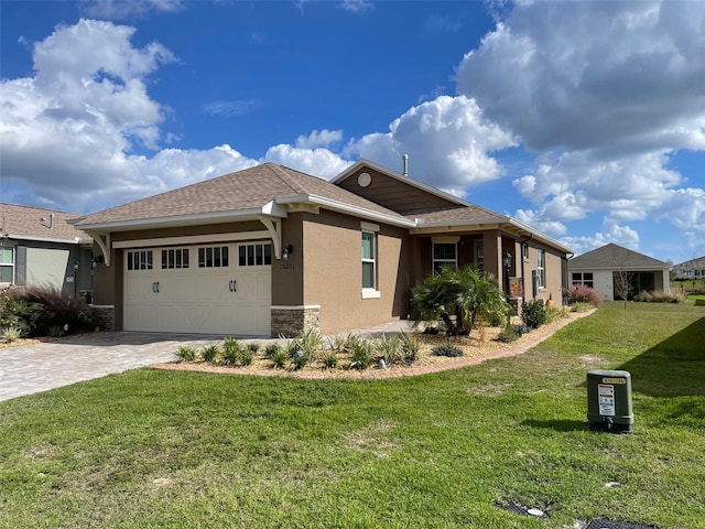 view of side of property with a lawn and a garage