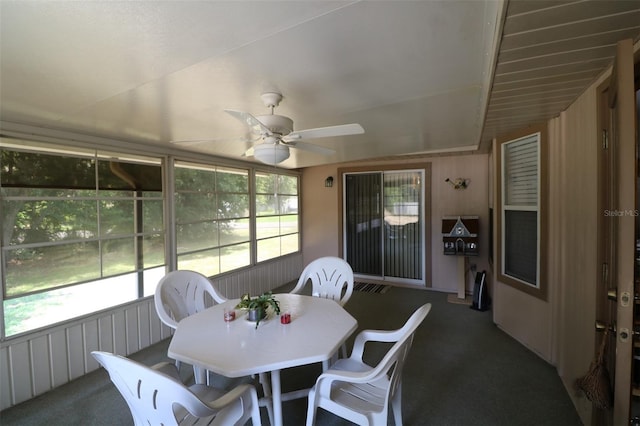 sunroom with a wealth of natural light, vaulted ceiling, and ceiling fan