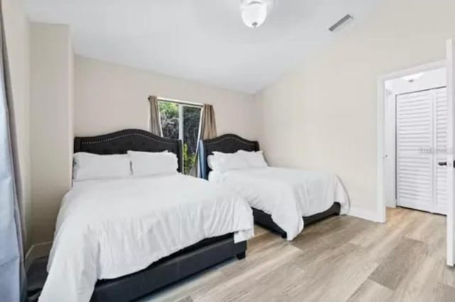 bedroom with a closet and light wood-type flooring