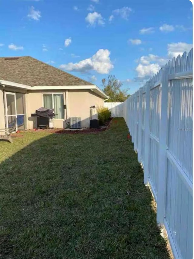 view of yard featuring central AC