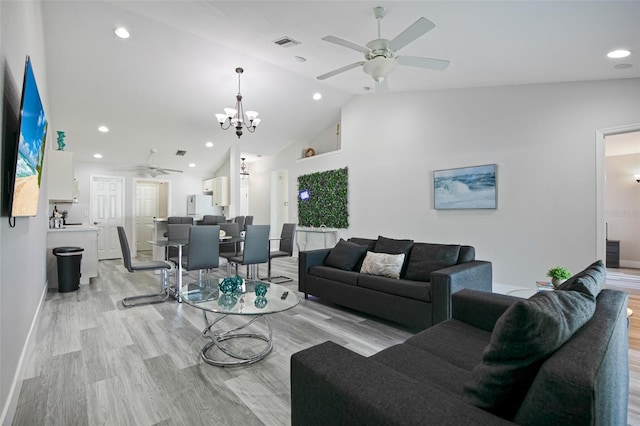 living room with recessed lighting, light wood-type flooring, visible vents, and ceiling fan with notable chandelier