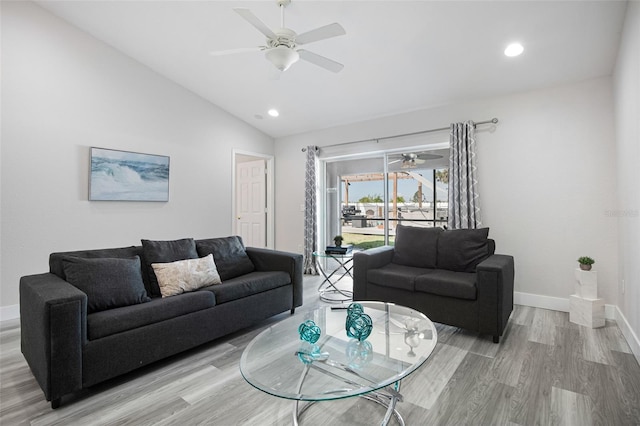 living room with a ceiling fan, vaulted ceiling, recessed lighting, light wood finished floors, and baseboards