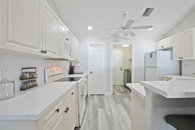 kitchen featuring light wood-type flooring, white appliances, white cabinets, visible vents, and ceiling fan