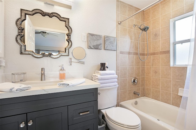 bathroom with toilet, vanity, and shower / washtub combination