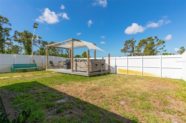 view of yard with a fenced backyard and a wooden deck