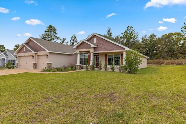 craftsman inspired home with a garage and a front lawn