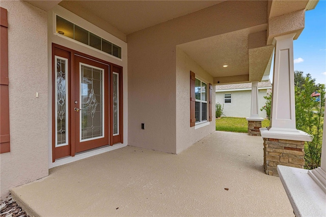 property entrance featuring a porch