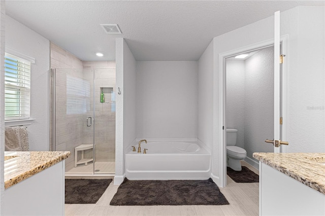 full bathroom with shower with separate bathtub, vanity, a textured ceiling, and toilet