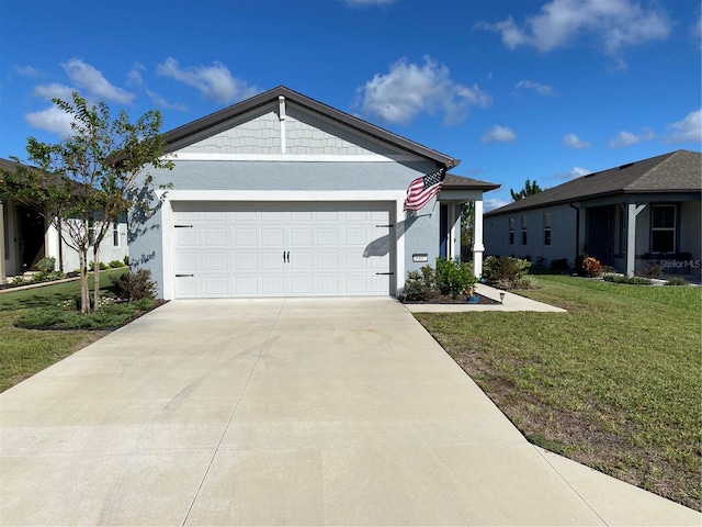 ranch-style house featuring a front yard and a garage