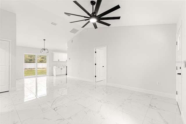 unfurnished living room featuring ceiling fan and lofted ceiling