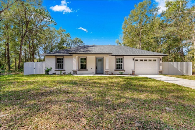 ranch-style home with a garage, a front yard, and covered porch