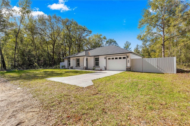 ranch-style house with a garage and a front lawn