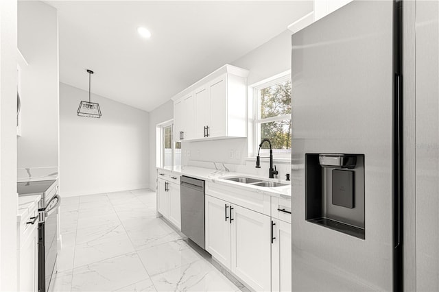 kitchen featuring vaulted ceiling, sink, white cabinetry, stainless steel appliances, and light stone counters