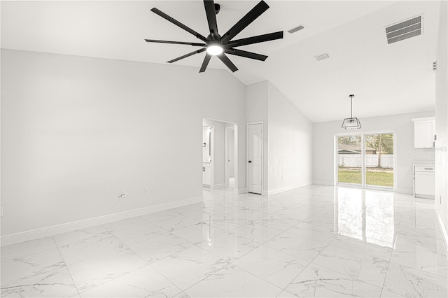 empty room with ceiling fan and lofted ceiling