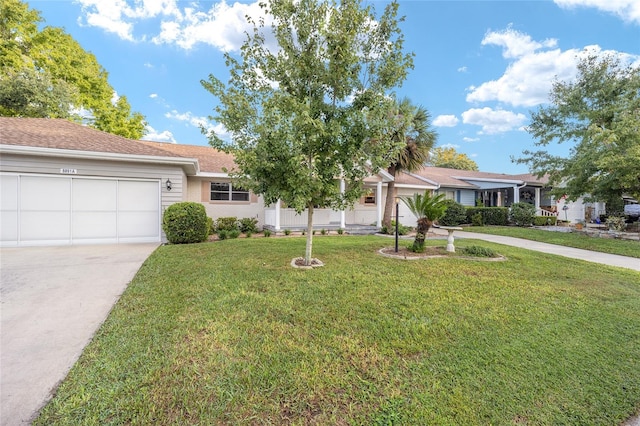 ranch-style house with a front yard and a garage