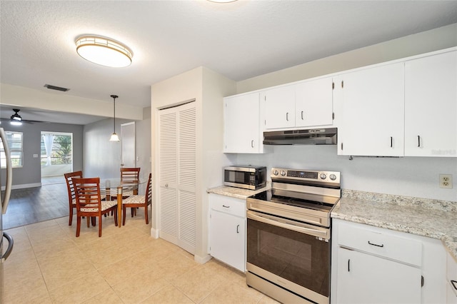 kitchen featuring a textured ceiling, white cabinets, appliances with stainless steel finishes, decorative light fixtures, and ceiling fan