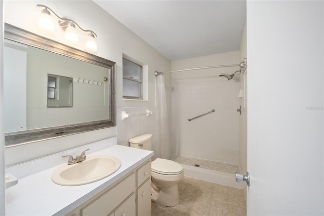 bathroom with toilet, vanity, tile walls, tile patterned flooring, and a shower with curtain