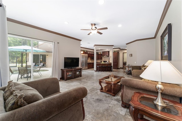 living room featuring ceiling fan and ornamental molding