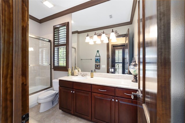 full bathroom featuring tile patterned floors, crown molding, toilet, shower / bath combination with glass door, and vanity