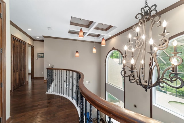 hall featuring ornamental molding, coffered ceiling, a notable chandelier, beamed ceiling, and dark hardwood / wood-style floors