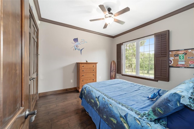 bedroom featuring dark hardwood / wood-style flooring, ceiling fan, and ornamental molding