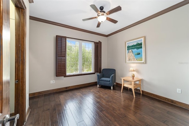 sitting room with crown molding, dark hardwood / wood-style flooring, and ceiling fan