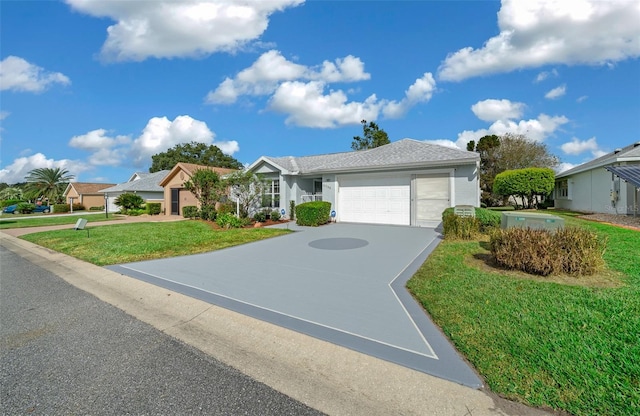 view of front facade featuring a garage and a front lawn