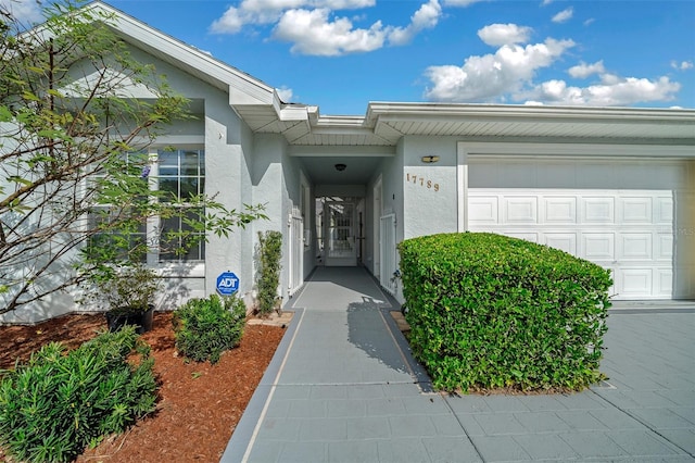 property entrance with a garage