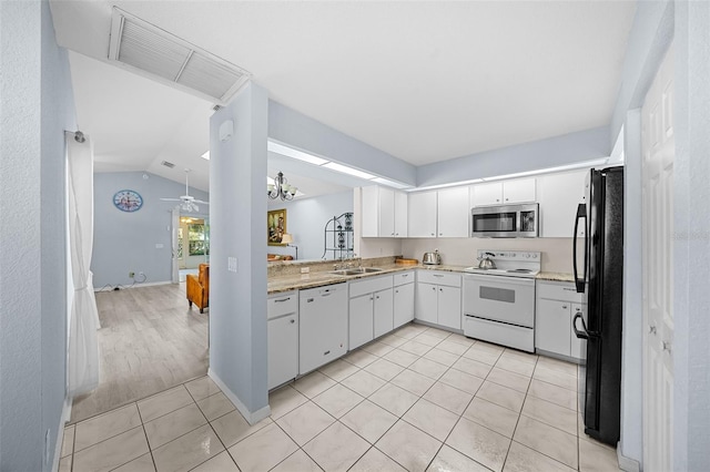 kitchen featuring lofted ceiling, white appliances, white cabinets, light hardwood / wood-style flooring, and ceiling fan