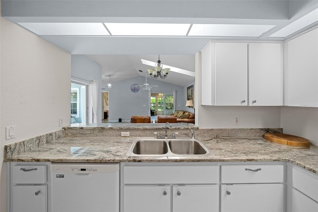 kitchen featuring white cabinetry, dishwasher, sink, lofted ceiling with skylight, and plenty of natural light