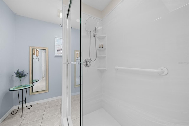 bathroom with tile patterned flooring and a shower with door