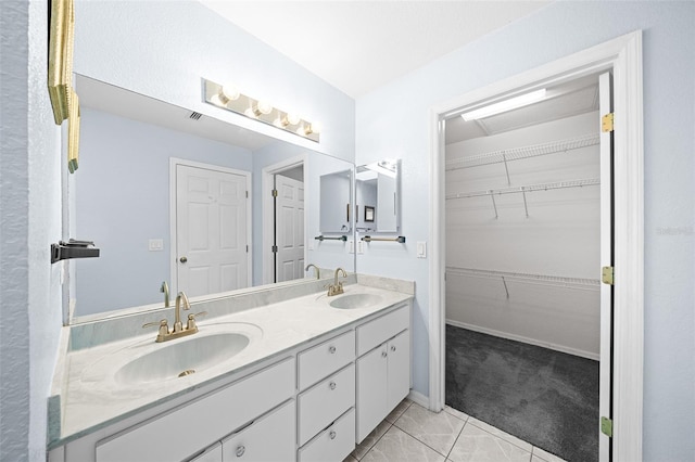 bathroom featuring tile patterned floors and vanity