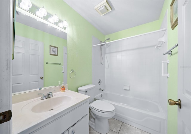 full bathroom with tile patterned floors, toilet, vanity, and tiled shower / bath