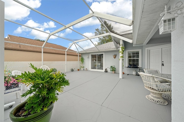 view of patio / terrace with glass enclosure