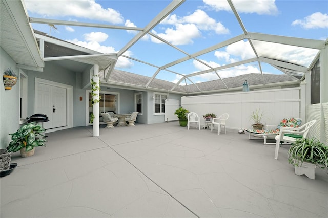 view of patio / terrace with a lanai