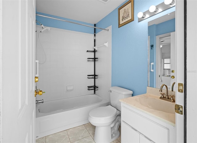 full bathroom with tile patterned flooring, vanity, toilet, and tiled shower / bath