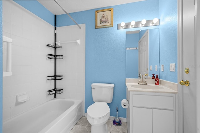 full bathroom with tile patterned flooring, vanity, toilet, and tiled shower / bath