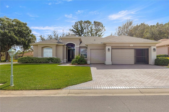 ranch-style home featuring a front lawn and a garage