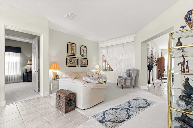 living room with light carpet and a healthy amount of sunlight