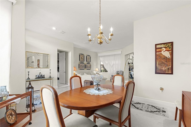 dining room featuring a chandelier