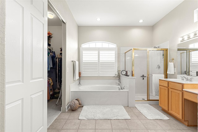 bathroom with plus walk in shower, tile patterned floors, and a healthy amount of sunlight