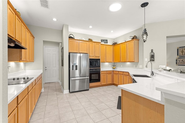 kitchen with black appliances, pendant lighting, light stone countertops, sink, and kitchen peninsula