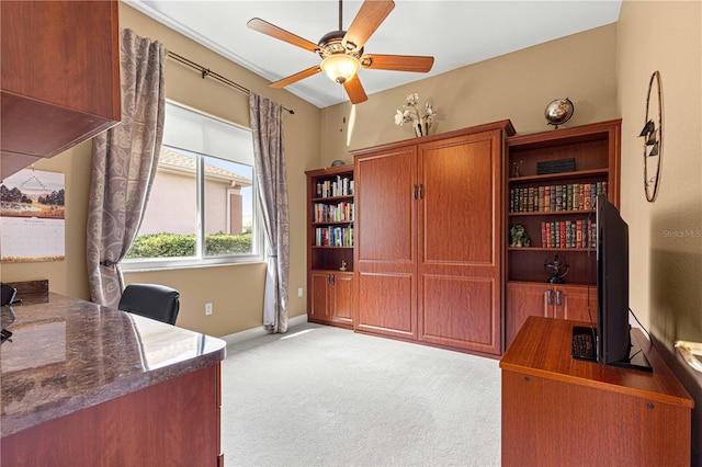 office area with ceiling fan and light carpet