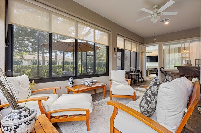 sunroom / solarium with ceiling fan