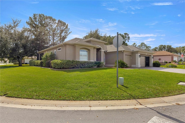 ranch-style home with a garage and a front yard