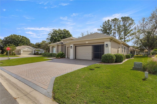 view of front facade featuring a front yard and a garage