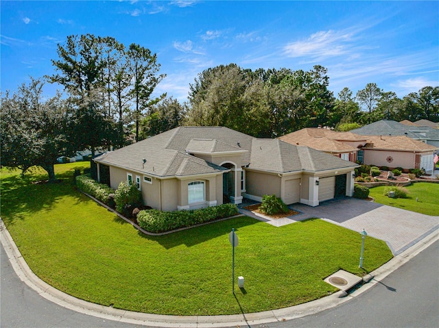 view of front of house with a garage and a front yard